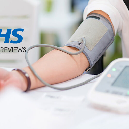 Person having their blood pressure measured with a digital monitor, with NHS Health Reviews logo.