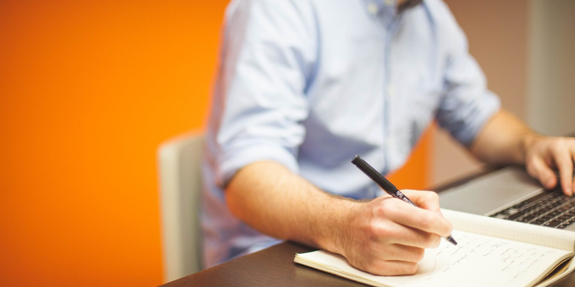 Clerk taking notes at their desk
