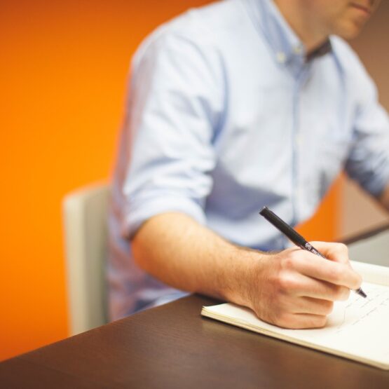 Clerk taking notes at their desk