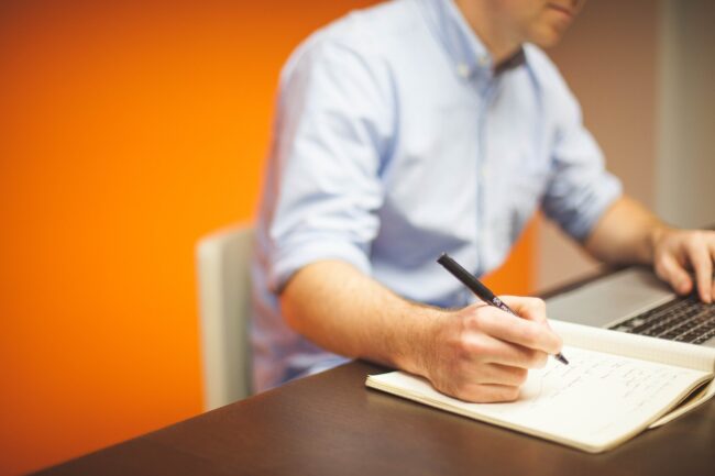 Clerk taking notes at their desk